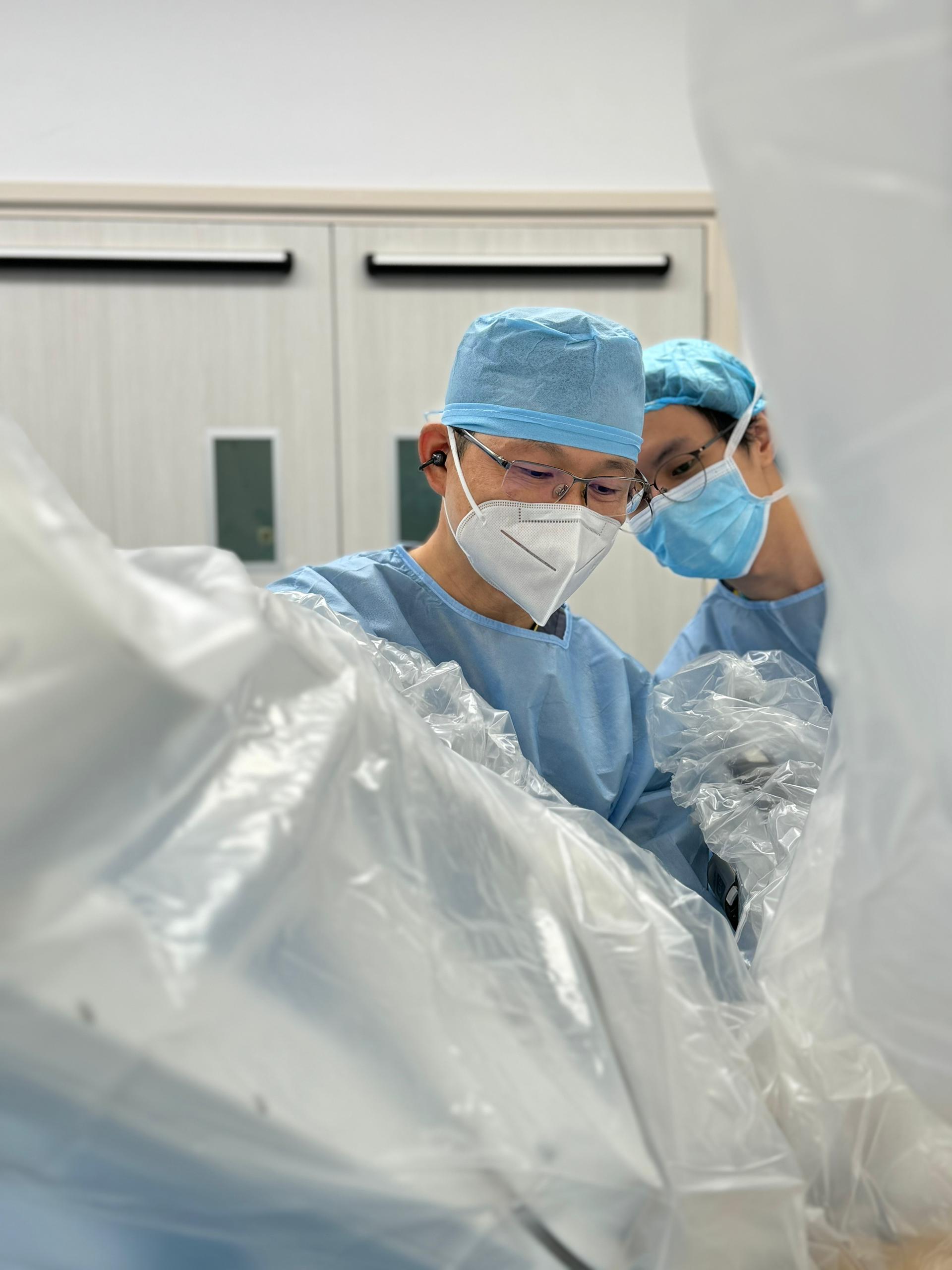 Dr Cha and surgical team in the operating theatre